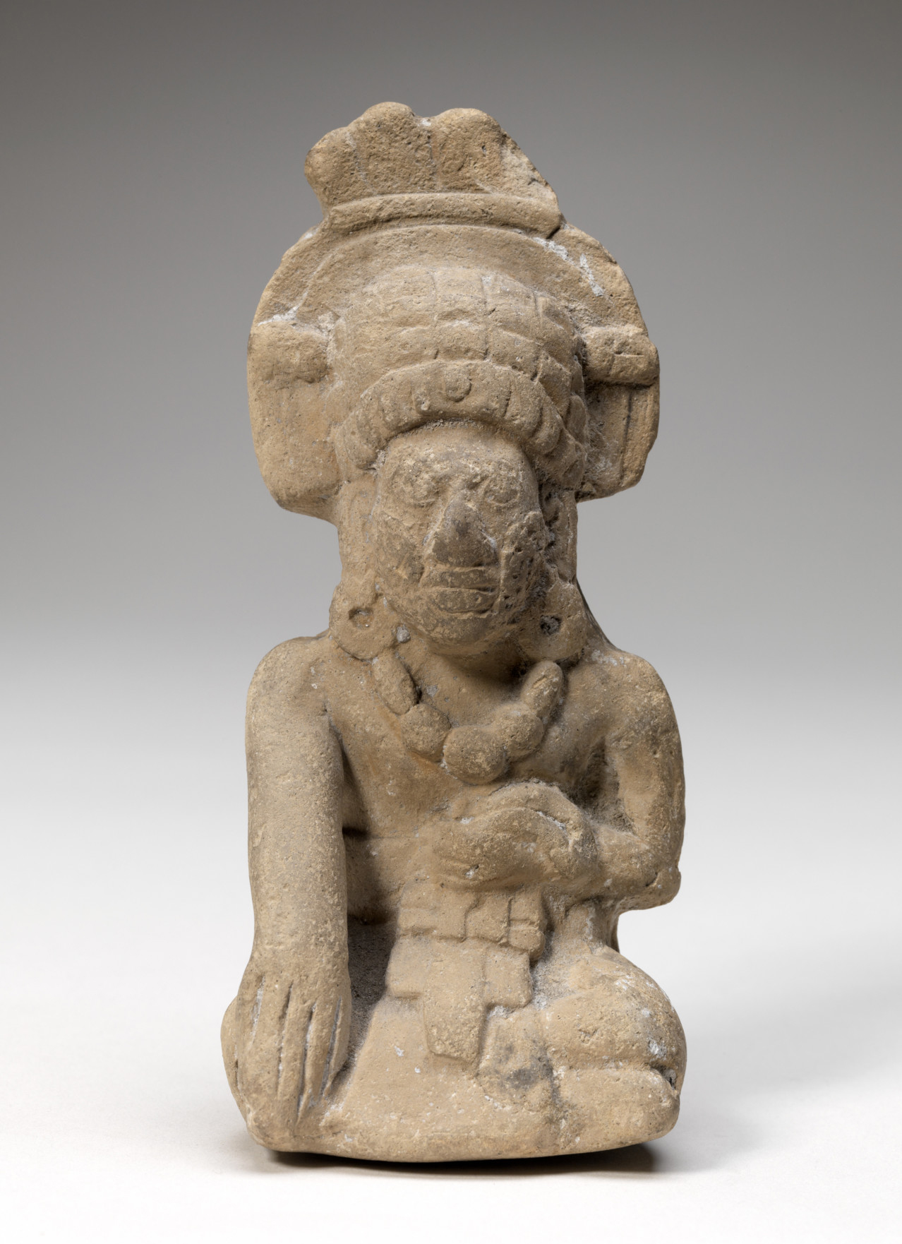 Unknown (Southern Campeche, Mayan, Mexican), Whistle figurine, Late Classic, 600-900CE. Mold-made terracotta, 5 1/16 x 2 5/16 x 2 5/8 in. Gift of Herbert D. N. Jones, Class of 1914. (21.1.3)