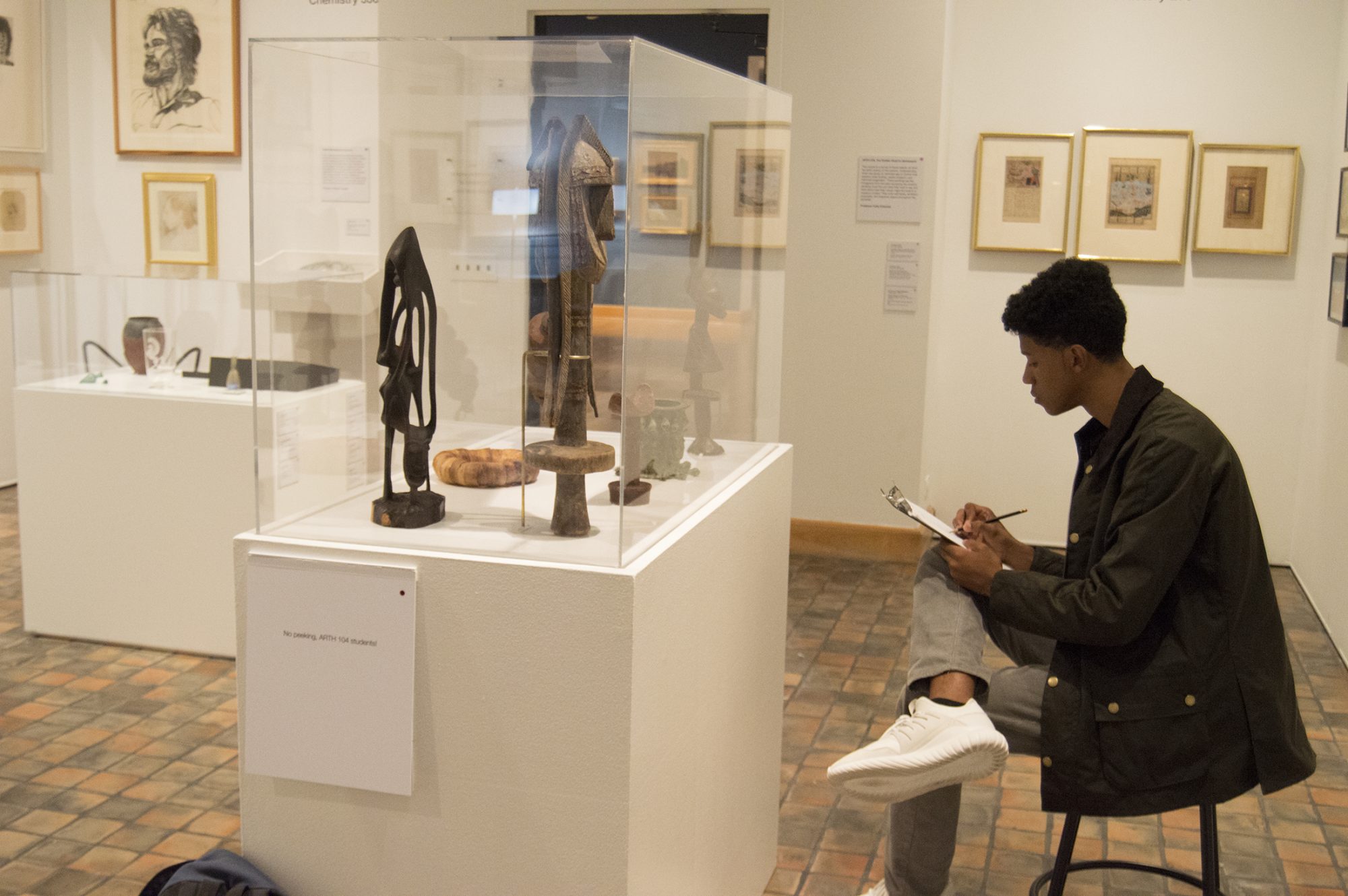 ARTH 104 student in Object Lab, fall 2016. Photo of a student in Object Lab.