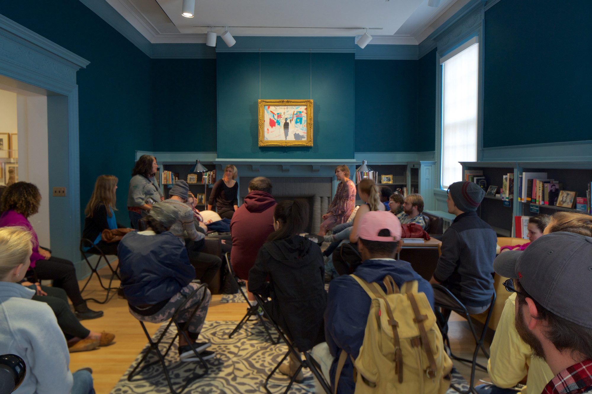 Students in conversation in the Reading Room. RS55047_20161025_MCLA_class_09-lpr