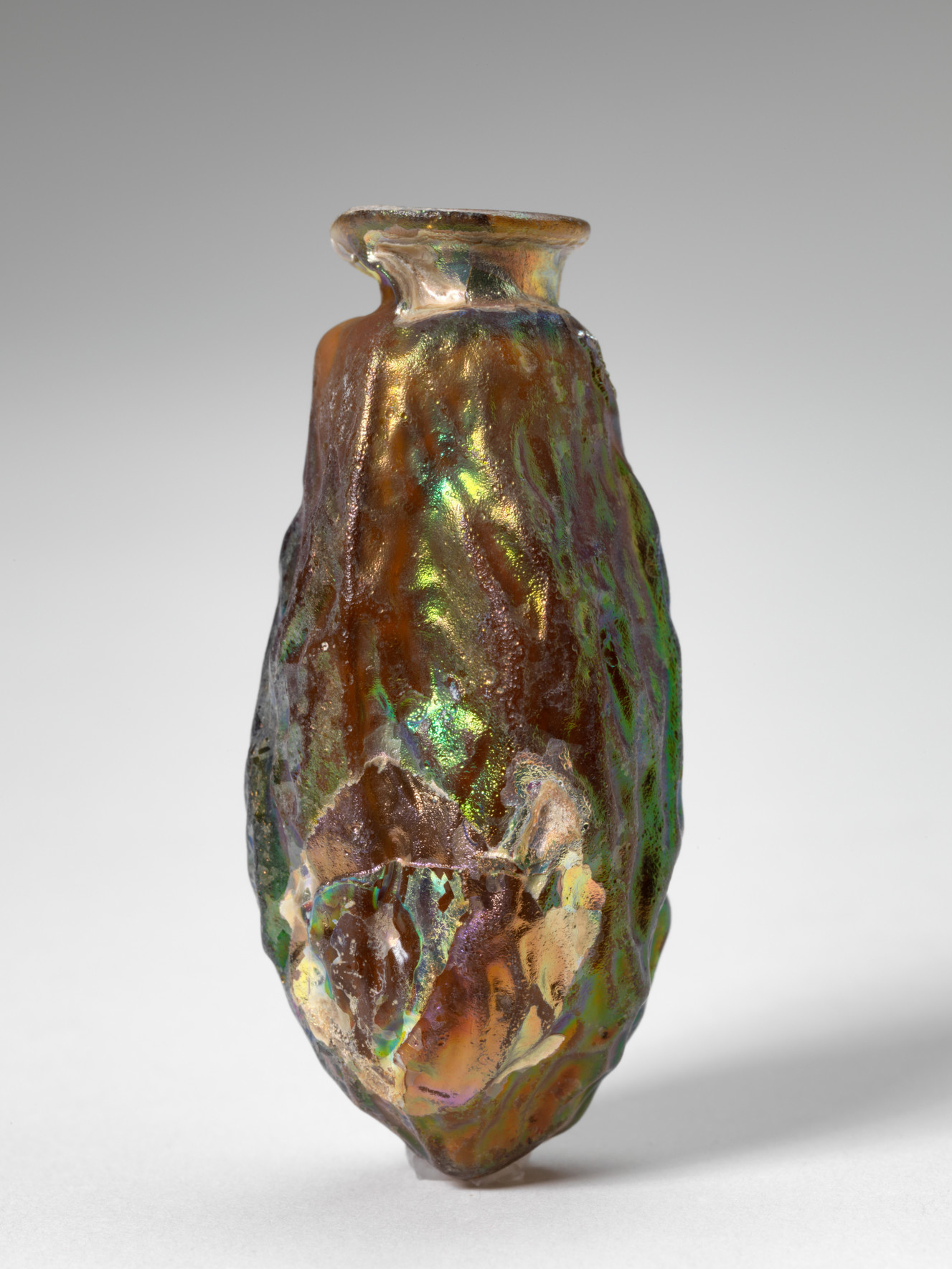Roman, Date-shaped flask, 50-200 AD. Mold-blown glass, 2 1/2 x 1 1/16 in. Gift of Mrs. Charles T. Cook, 30.1.8. Roman, Date-shaped flask, 50-200 AD. Mold-blown glass, 2 1/2 x 1 1/16 in. Gift of Mrs. Charles T. Cook, 30.1.8.