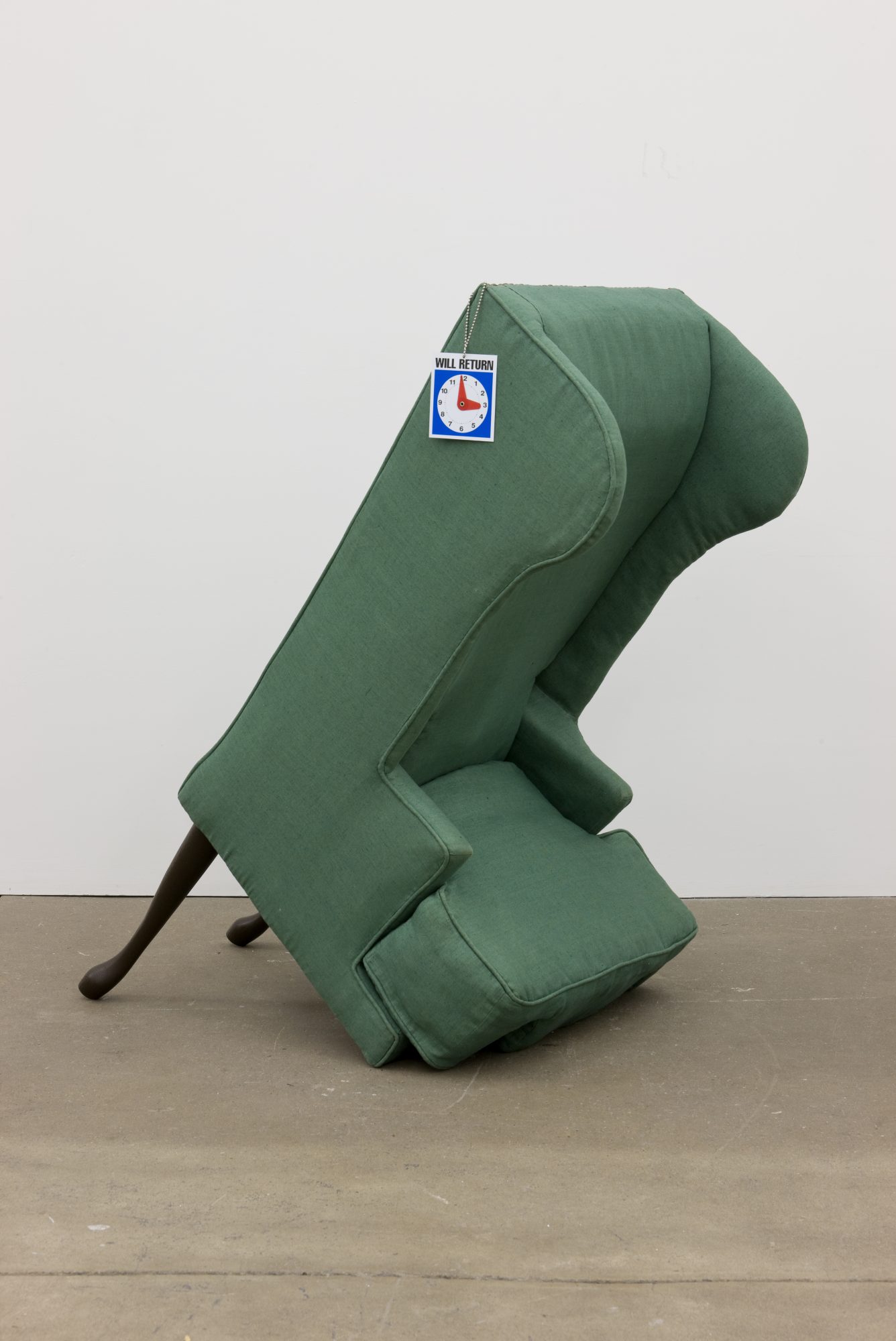 Jamie Isenstein (American, b.1975) Arm Chair, 2006. Wood, metal, nylon, raw cotton, linen, hardware, human arms, human legs, Will Return sign. Collection of Andrew Ong. Image courtesy of the Artist and Andrew Kreps Gallery, New York