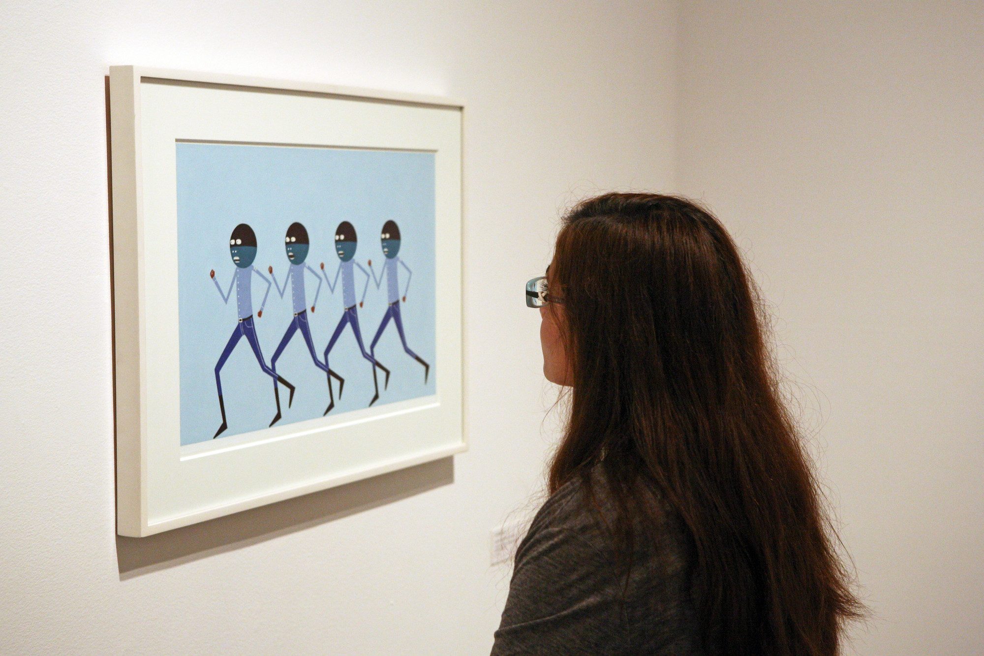 Installation view of Laylah Ali: The Greenheads Series with students from Exploring the Arts. Photo by Roman Iwasiwka.