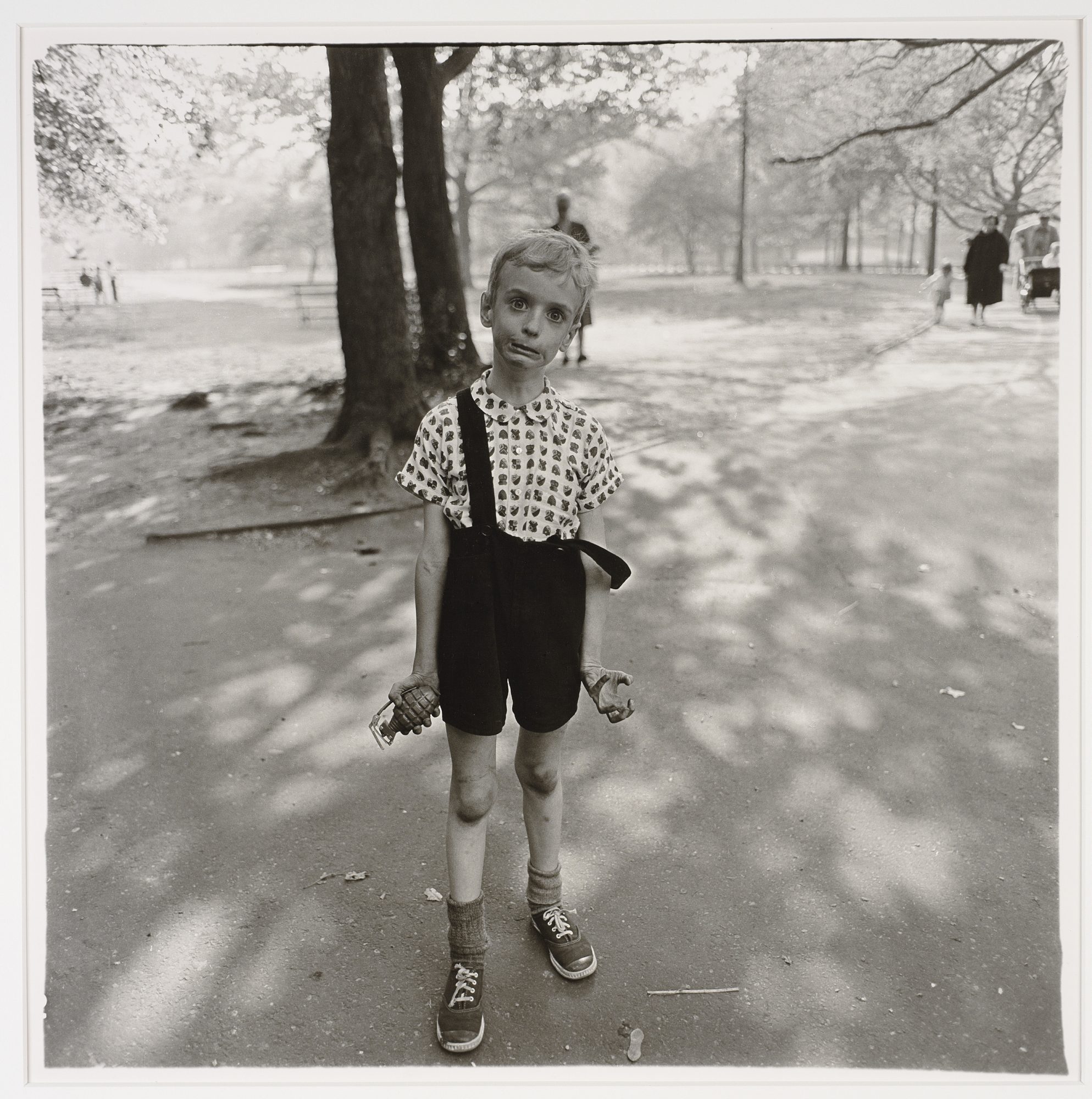 Child with a Toy Hand Grenade in Central Park, NYC