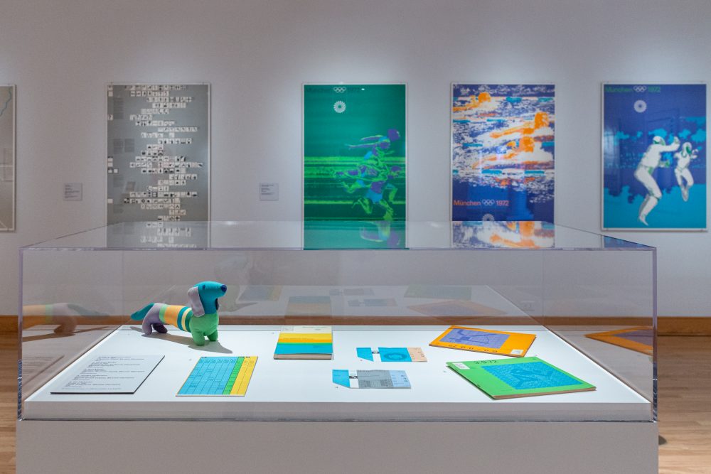 Installation view of exhibition showcasing posters and other graphic design from the 1972 Munich Olympic Games